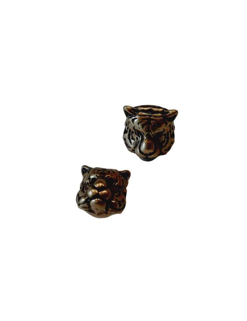 Une perle tête de tigre couleur bronze avec un trou de 1.5mm