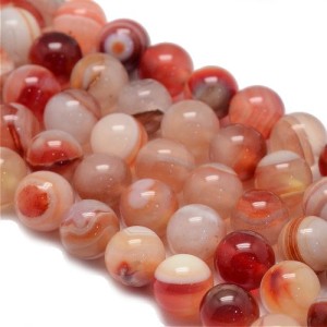 Fil de 47 perles rondes de 8mm en agate striées saumon rouge